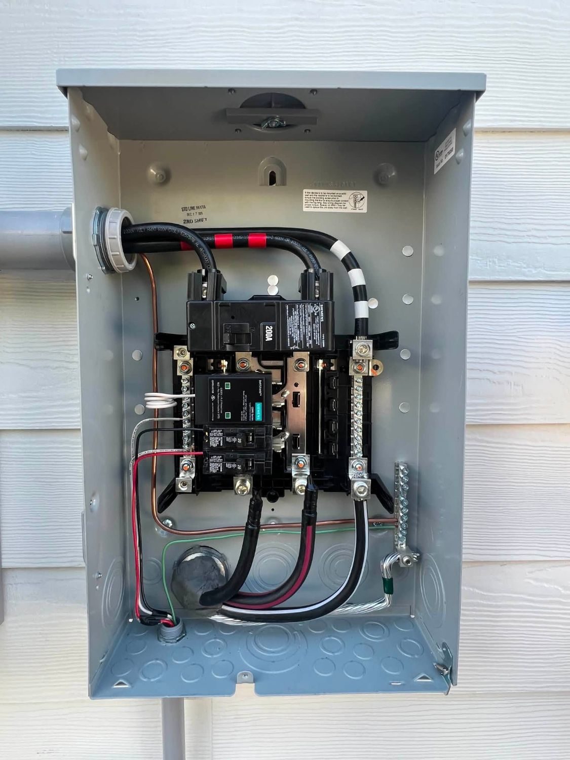 Newly installed 200 amp electrical panel with backup power monitoring hardware